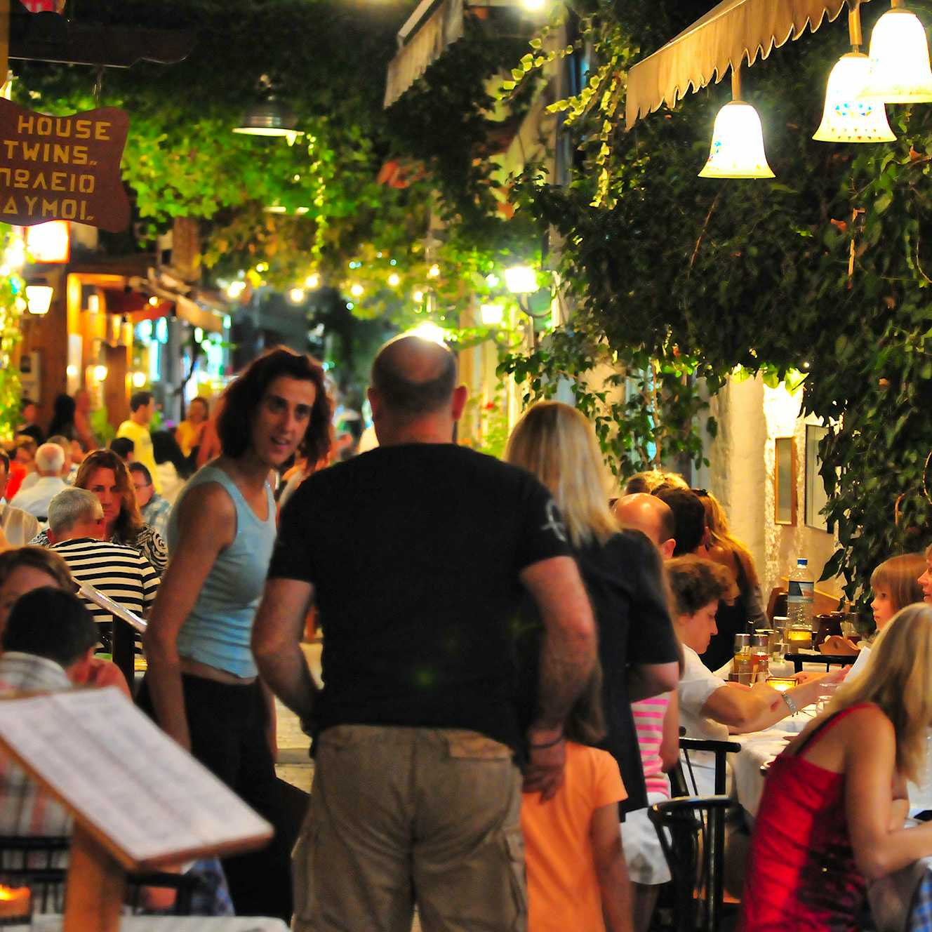 Photo Caption: Eat at traditional tavernas & experience the vibrant nightlife